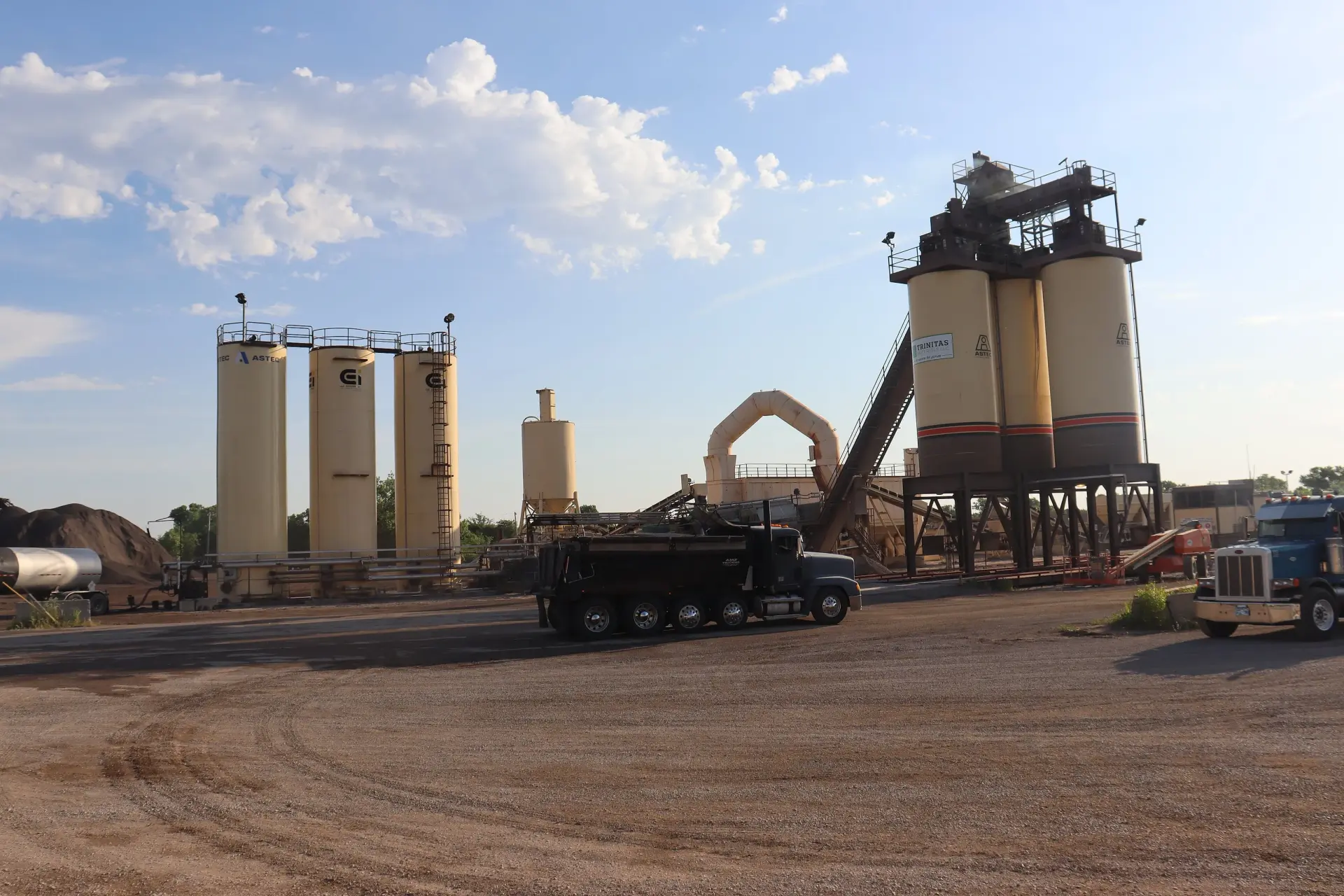 Wide view of the Trinitas Materials asphalt plant at golden hour